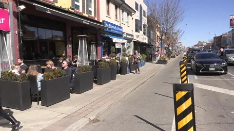 The Danforth Greektown in Toronto Canada on a nice sunny day Stock Footage 150773638