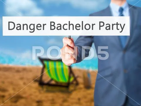 Danger Bachelor Party - Businessman hand holding sign Stock Photos