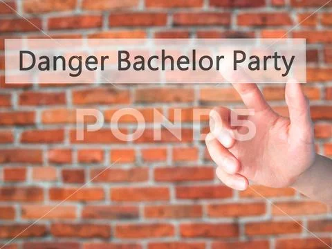 Danger Bachelor Party - Hand pressing a button on blurred backgr Stock Photos