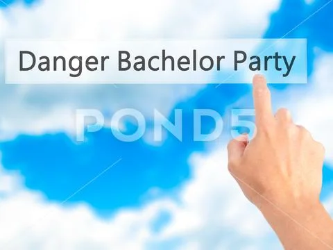 Danger Bachelor Party - Hand pressing a button on blurred backgr Stock Photos
