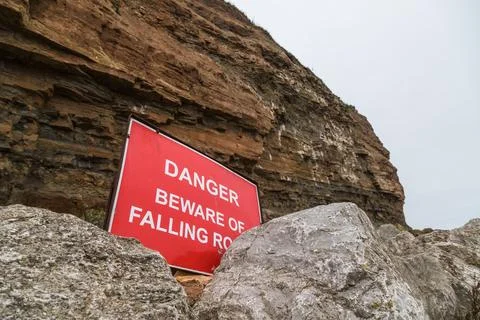 Danger beware of falling rocks Stock Photos
