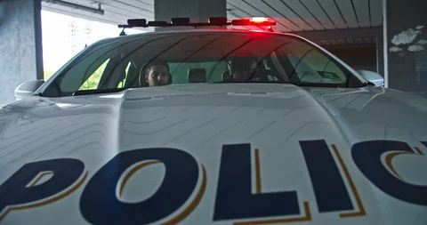 Danger in the city. Hurrying professional armed police officers run out of Stock Footage 112952302