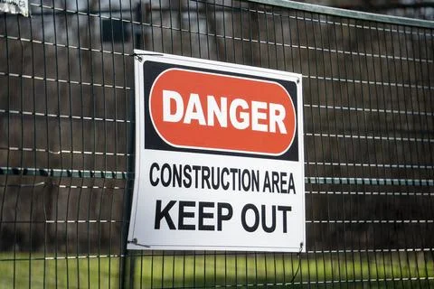 Danger Construction Area Keep Out Sign on Metal Fence Stockfoto's