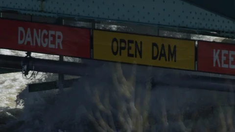 Danger Dam panning slow motion water explosion sign Stock Footage 107169526