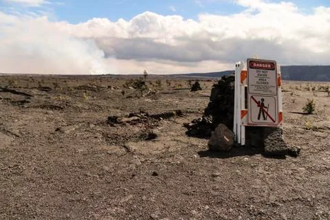 Danger do not enter area close sign, Kilauea crater with caldera in backgroun Stock Photos