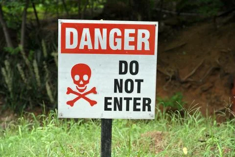 Danger Do Not Enter Safety Warning Sign with Skull and Crossbones Outdoors Stock Photos