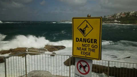 Danger do not go near the edge Coogee Sydney cliff top 6K Stock-Footage 305425800