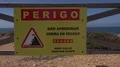 Danger don't walk at the cliffs sign at Portugal southern tourism spot Sagres 4k 4k or 4k+ Resolution