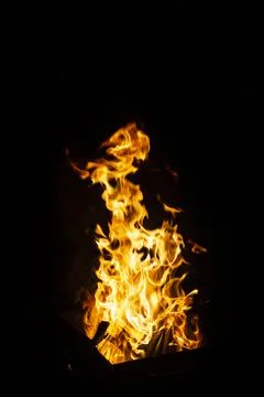 Danger fire on a dark background. Background from fire. Fire pattern can be u Stock Photos