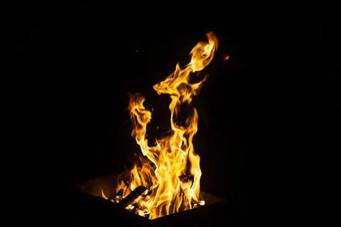 Danger fire on a dark background. Background from fire. Fire pattern can be u 스톡 사진