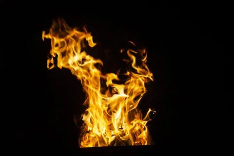 Danger fire on a dark background. Background from fire. Fire pattern can be u Stock Photos