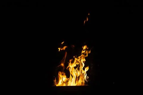 Danger fire on a dark background. Background from fire. Fire pattern can be u 스톡 사진