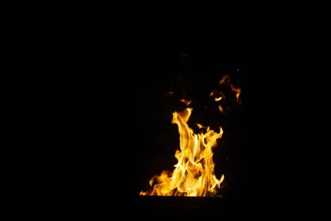Danger fire on a dark background. Background from fire. Fire pattern can be u 스톡 사진