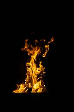 Danger fire on a dark background. Background from fire. Fire pattern can be u Stock Photos