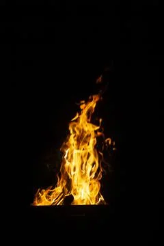 Danger fire on a dark background. Background from fire. Fire pattern can be u Stock Photos