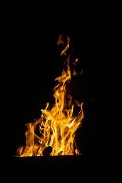 Danger fire on a dark background. Background from fire. Fire pattern can be u Stock Photos
