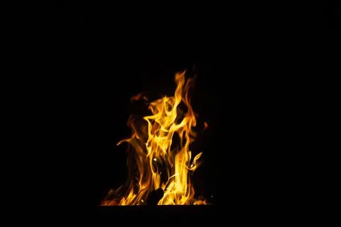Danger fire on a dark background. Background from fire. Fire pattern can be u Stock Photos