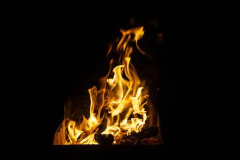 Danger fire on a dark background. Background from fire. Fire pattern can be u Stock Photos