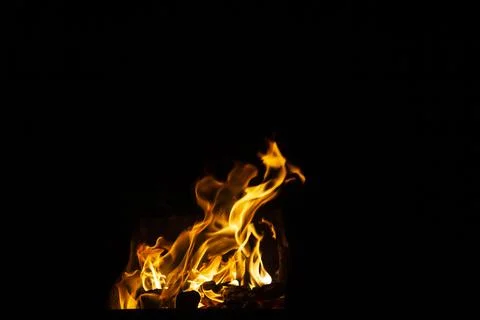 Danger fire on a dark background. Background from fire. Fire pattern can be u Stock Photos