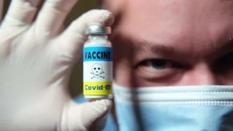 Danger, harm, negative consequences of vaccination concept. A man in a medica Stock Footage 147345881