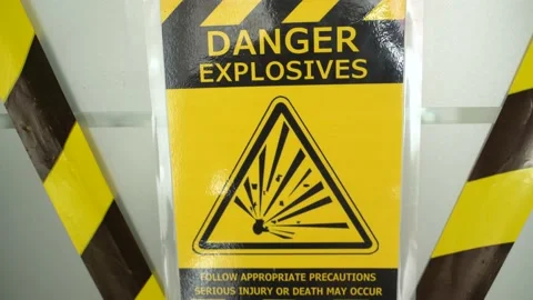 Danger hazard explosion warning safety sign with yellow precaution ribbon Stock Footage 165264172