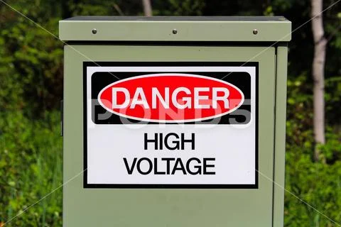A danger high voltage sign on an electrical box Stock Photos