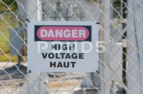 Danger High Voltage Sign in English and French Stock Photos