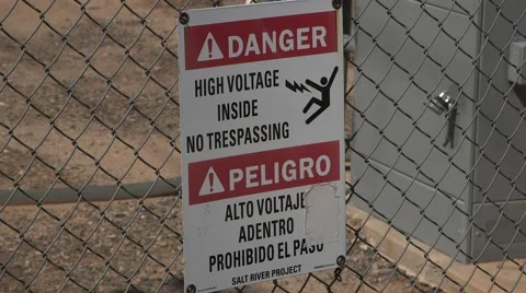 Danger high voltage sign protecting an electrical sub-station  Stock Footage 50092563