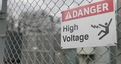 Danger High Voltage sign rack focus to massive generator  스톡 동영상 144064120