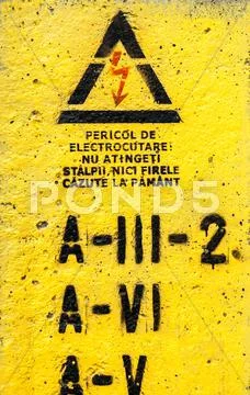 Danger, high voltage sign in yellow Stock Photos