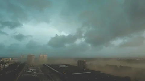 The danger hurricane with a rainy clouds above the city Stock Footage 111477196