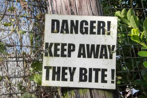 Danger - keep away  they bite - sign Stock Photos