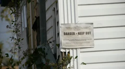 Danger keep out Sign on a home damaged by a Tornado in Birmingham, Alabama Stock Footage 10753955