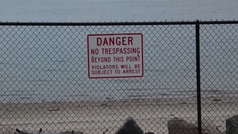 Danger No Trespassing Beyond This Point Violators Will Be Subject To Arrest Sign Stock Footage 152741776