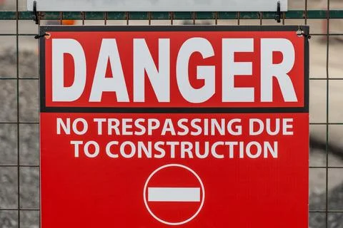 Danger no trespassing due to construction red warning sign Stock Photos