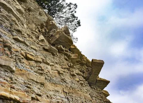 Danger ol falling rocks underneath Stock Photos