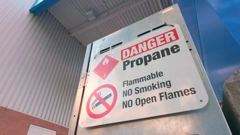 Danger propane warning sign on metal fuel storage locker Stock Footage 338033412