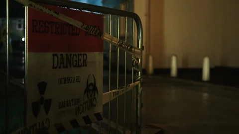 Danger, restricted access biohazard sign at night Stock Footage 104450964