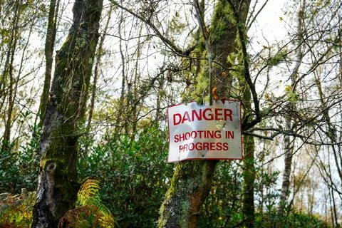 Danger shooting in progress sign Stockfoto's