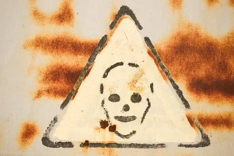 Danger sign on rusty surface Stock Photos