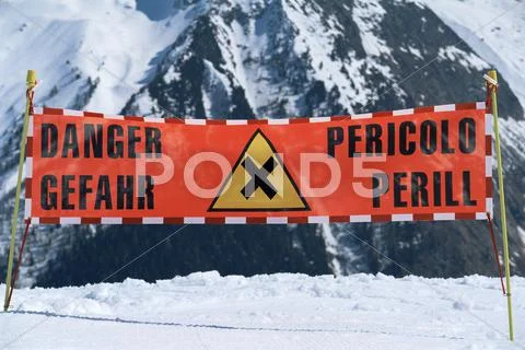 Danger Sign On Snowy Mountain (Selective Focus)