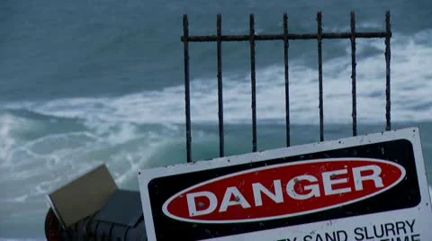 Danger Sign, Surf in background Stock Footage 10601895