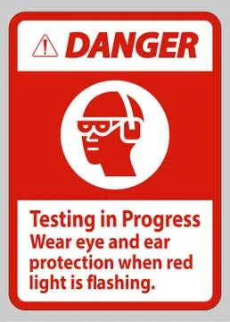Danger Sign Testing In Progress, Wear Eye And Ear Protection When Red Light I Illustrazione stock