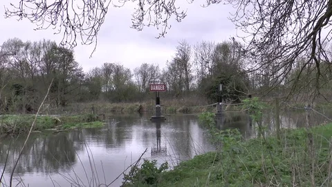 Danger sign by weir Video stock 73933184