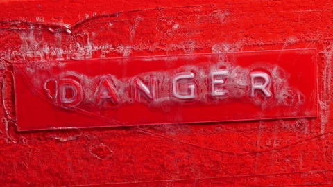 Danger text on burning wood surface. Stock Footage 137021010