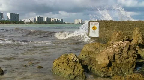 Danger warning slippery rocky beach Stock Footage 8979442