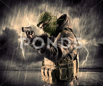 Dangerous armed terrorist with mask and gun in a thunderstorm with lightning Stock Photos