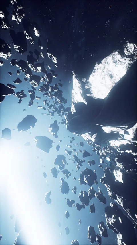 Dangerous asteroid field stretching across a misty nebula, vertical Stock Footage 324721697