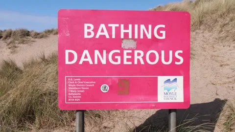 Dangerous Bathing danger warning sign red Runkerry Beach Portballintrae Video stock 305181275