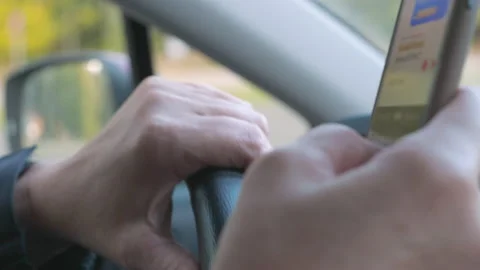 A dangerous behavior while driving a car | Stock Video | Pond5